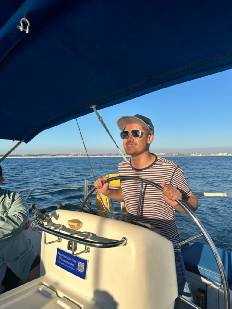 Captain posing on deck before a sailing experience in Florida.