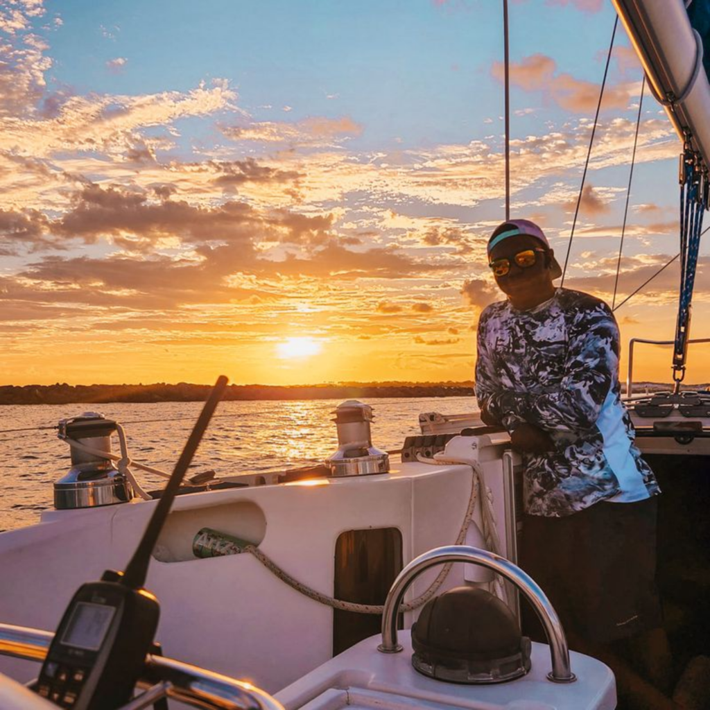 Experienced sailing captain smiling on deck in Florida.