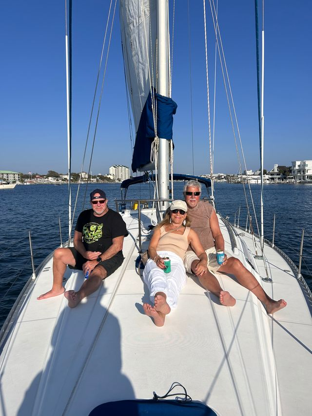 People enjoying a luxury sailing charter along the scenic Emerald Coast in Destin, Florida.